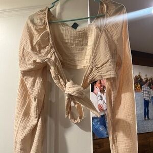 Tan long-sleeve cropped top blouse